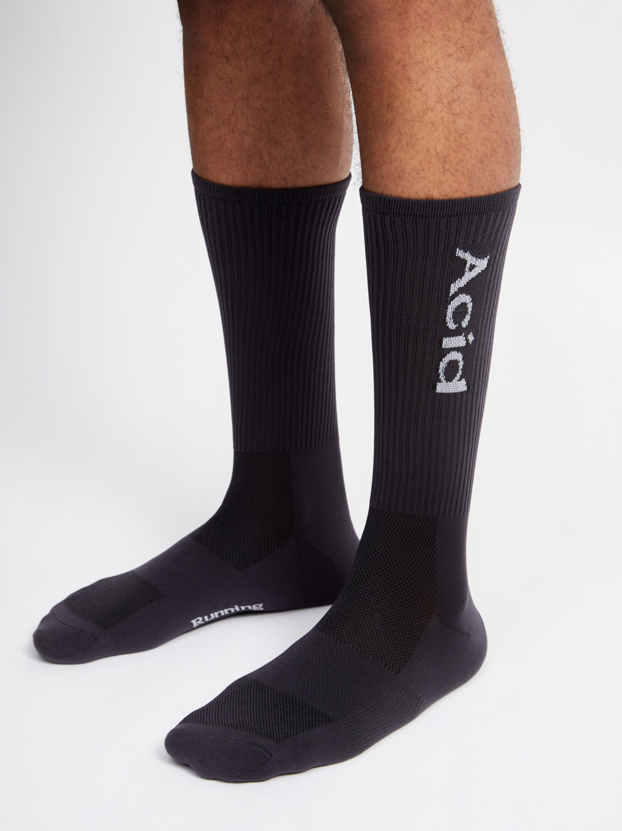 Black logo socks providing ankle height, breathable and sweat-wicking with maximum support.