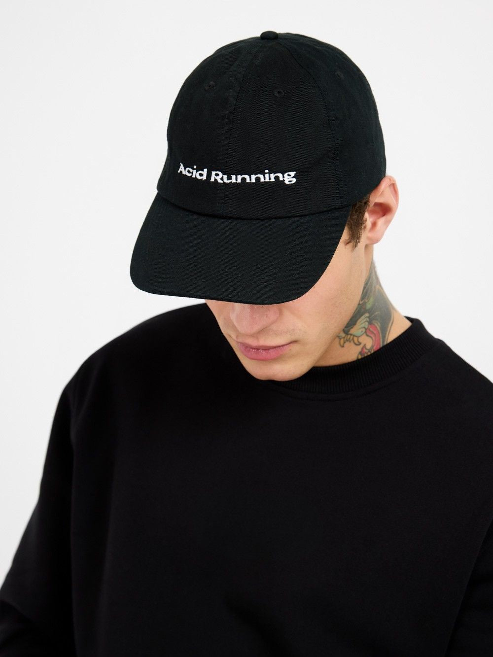 Luxury Pace Cap - Black, ethically made and embroidered, worn by person.