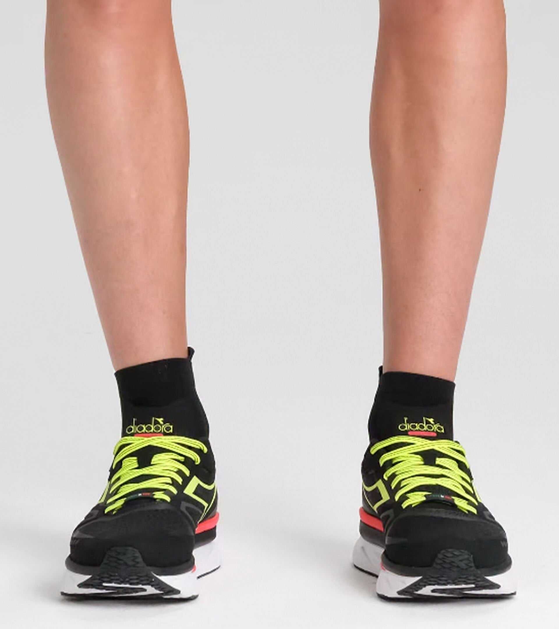 ATOMO V7000-2 sneakers with neon green laces.