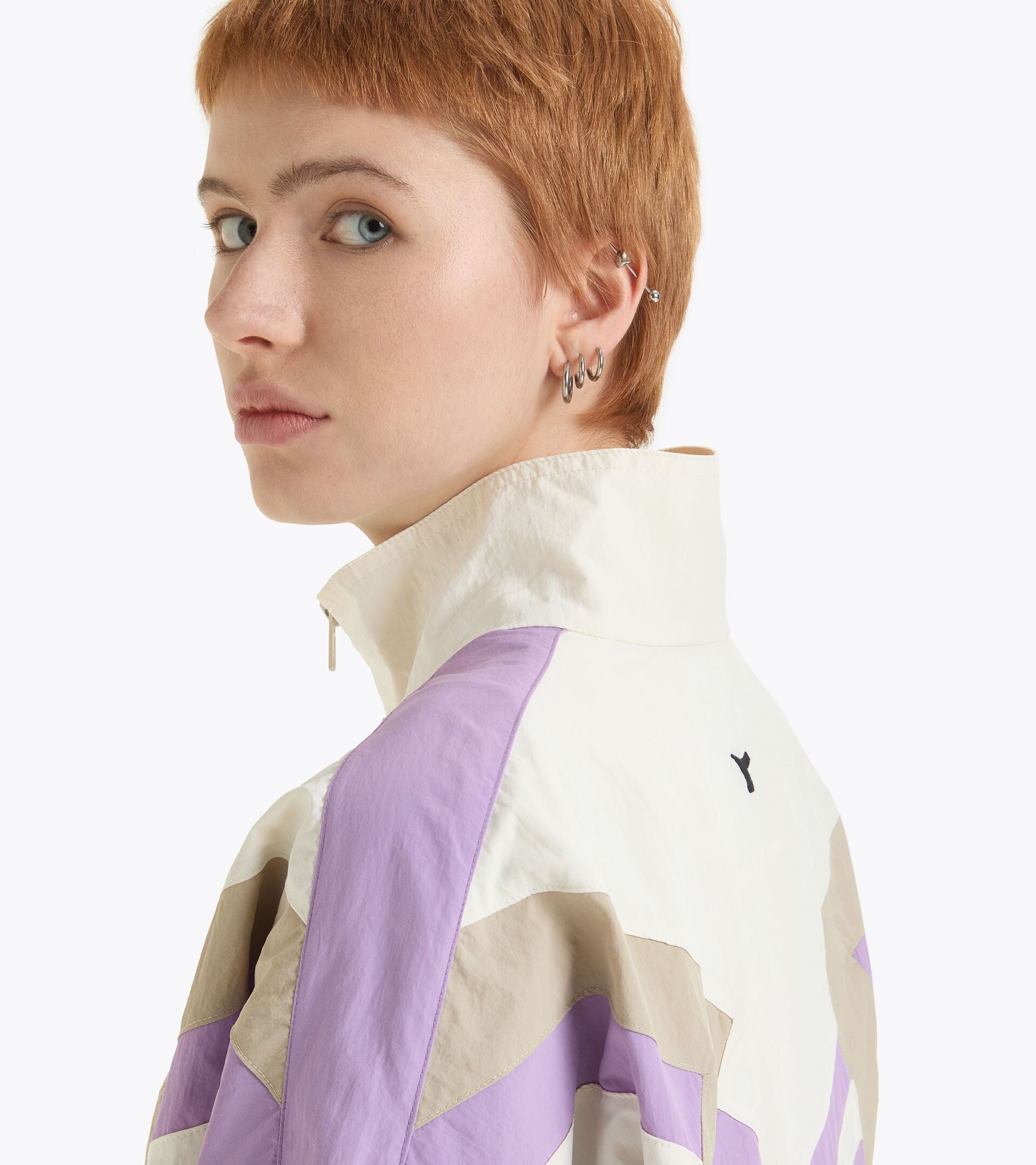 Gender-neutral Mill City track jacket with contemporary urban flair, in purple and beige, made in Italy.