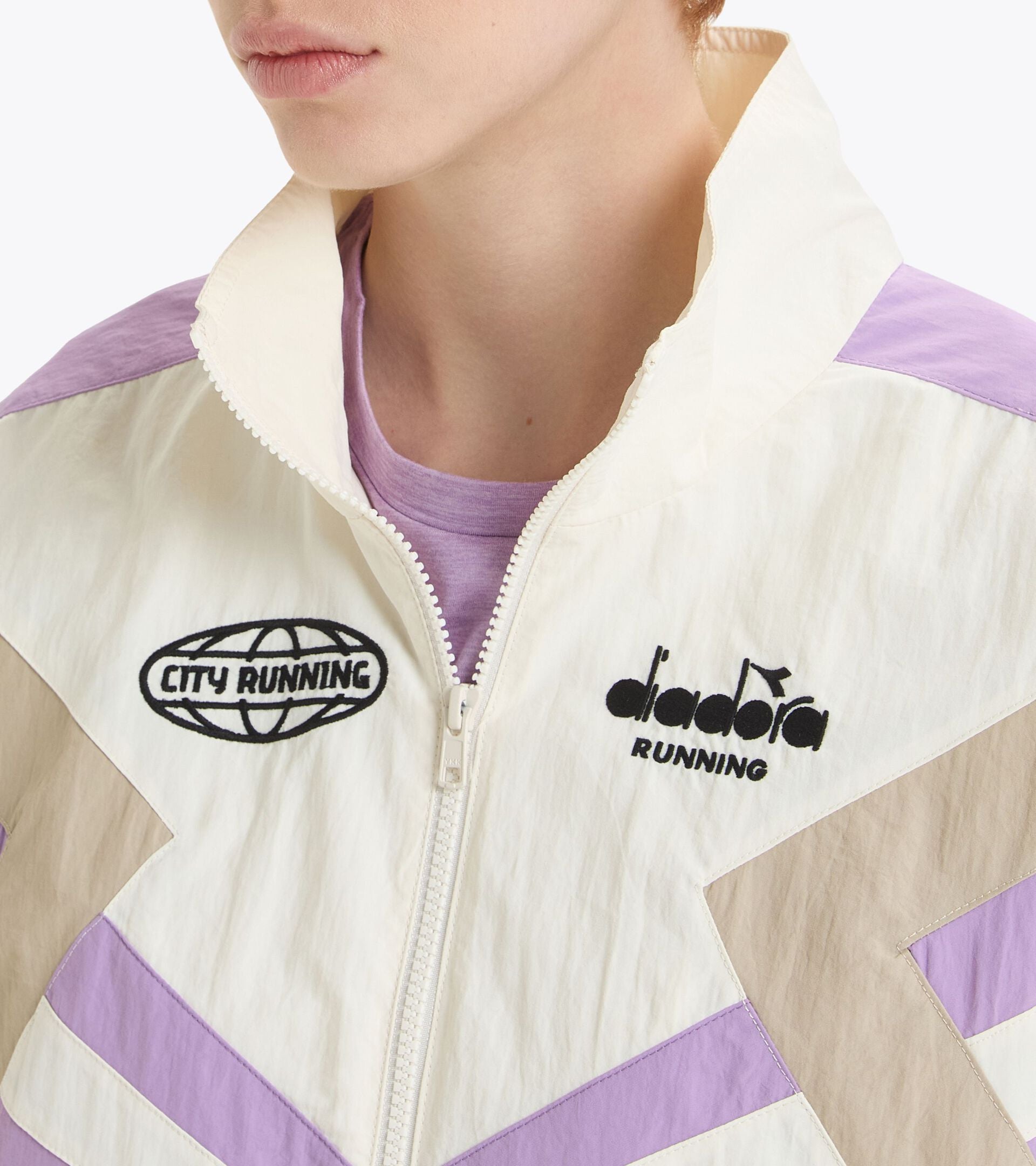 Gender-neutral TRACK JACKET MILL CITY with urban flair, Italian polyamide, mesh lining, Mill City logo.