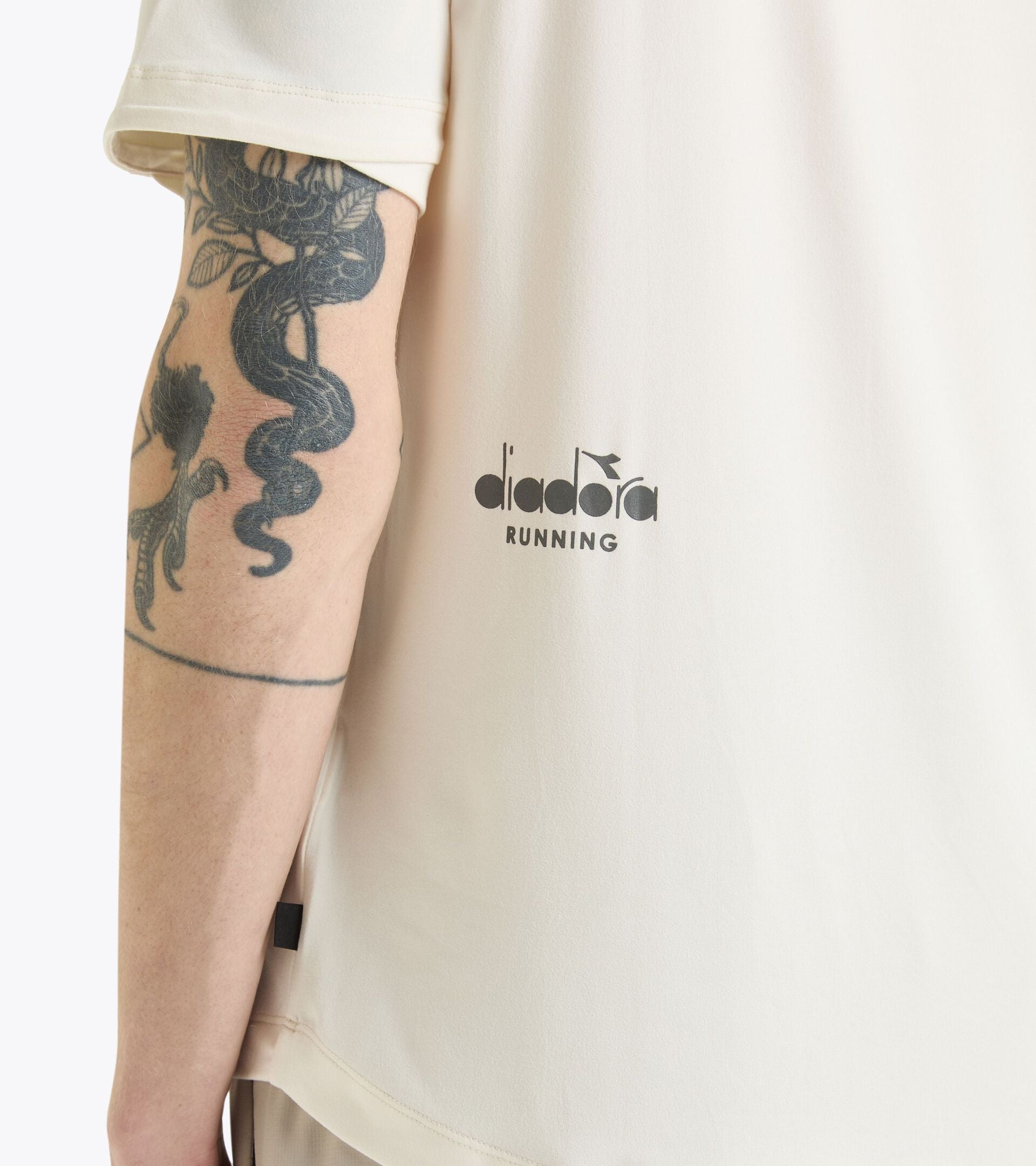 Unisex short sleeve white training t-shirt with logo, made from stretchy recycled polyester for performance.