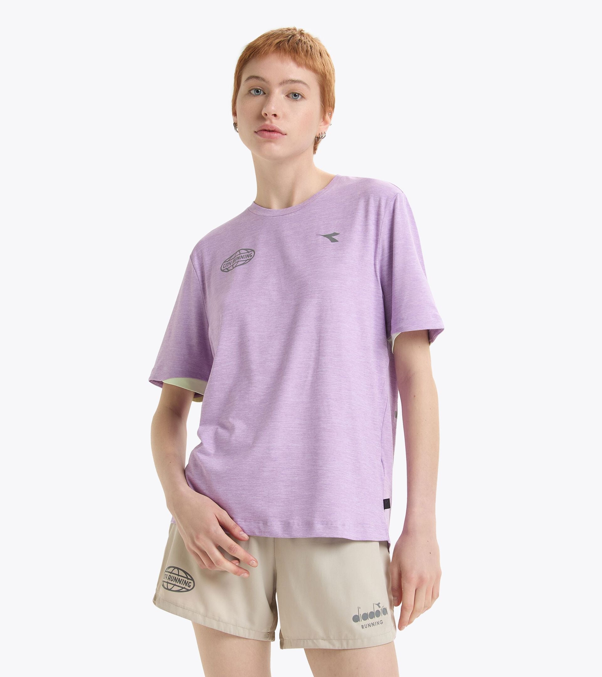 Unisex short sleeve purple training T-shirt for performance, featuring soft recycled polyester fabric, round neck, and tone-on-tone logos.