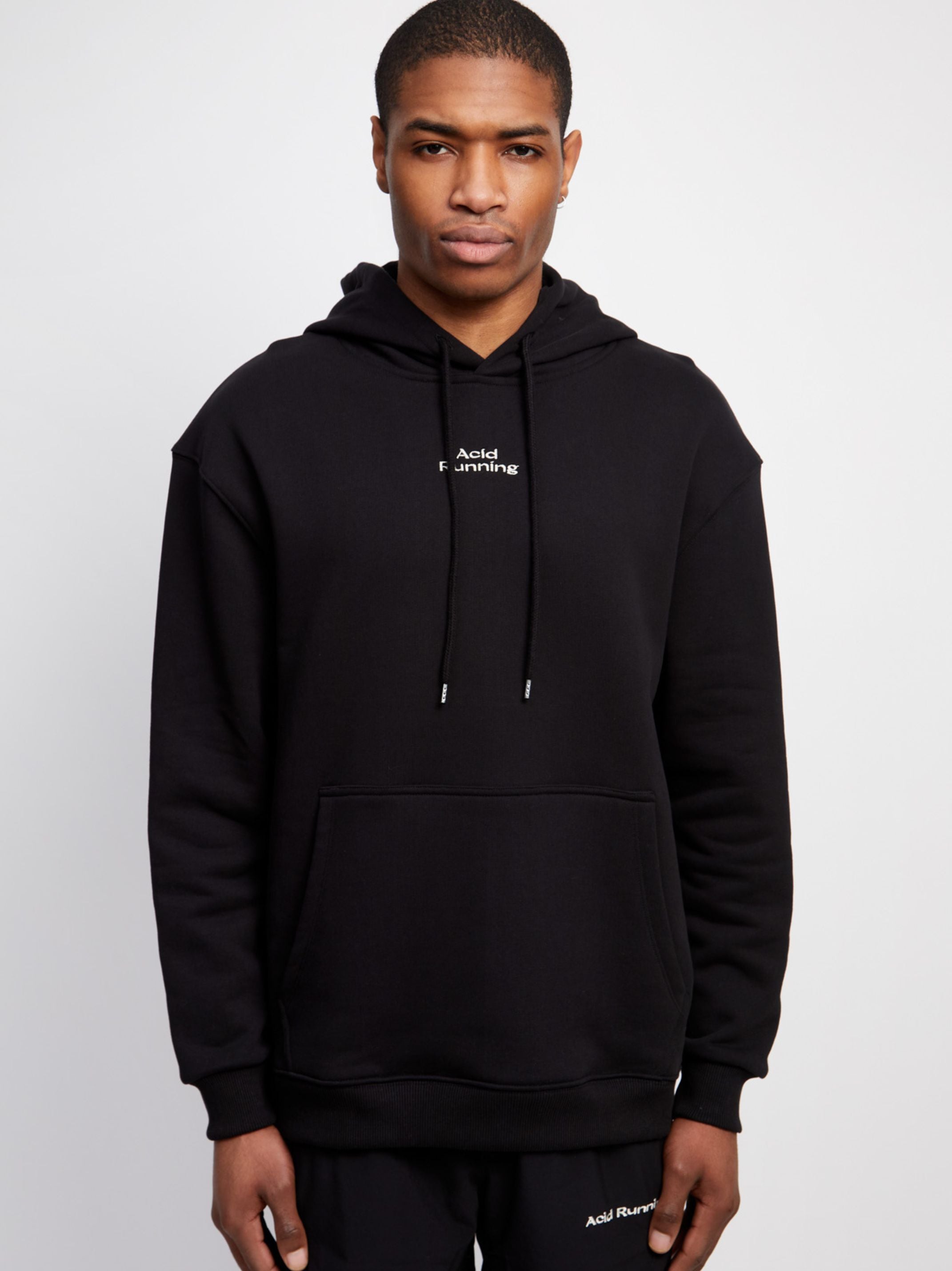 Black logo hoodie with off-white embroidery, acid hare print, made from organic cotton.