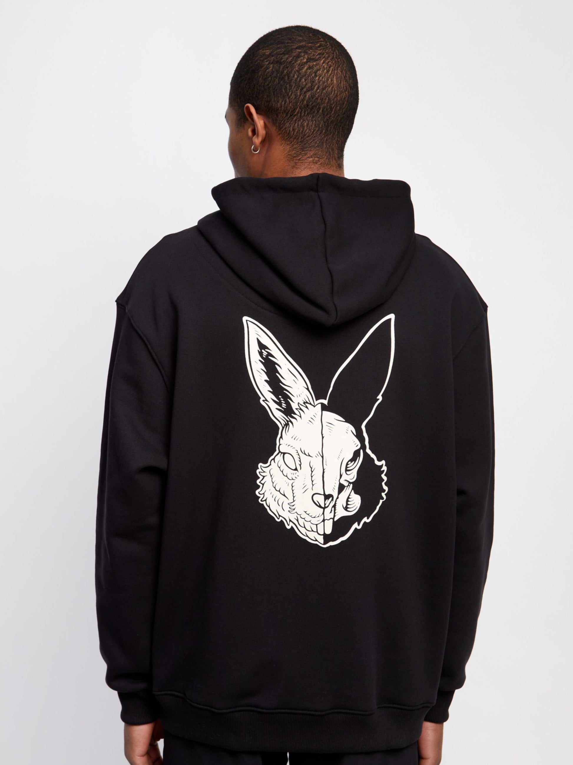 Black organic cotton hoodie with off-white logo embroidery and acid hare print on the back.