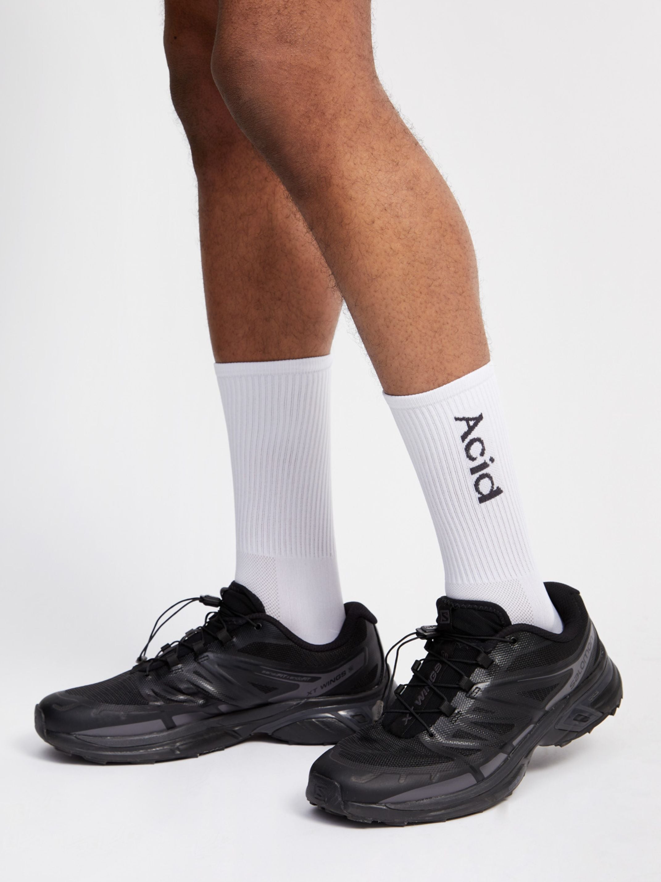 Logo Socks - White, ultra-lightweight and breathable, featuring off-black logo design.