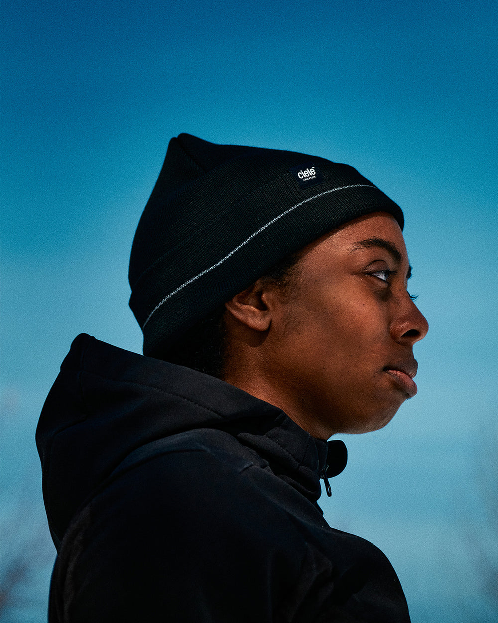 CR3Beanie - Shadowcast in black with reflective stripe, ideal for night runs.