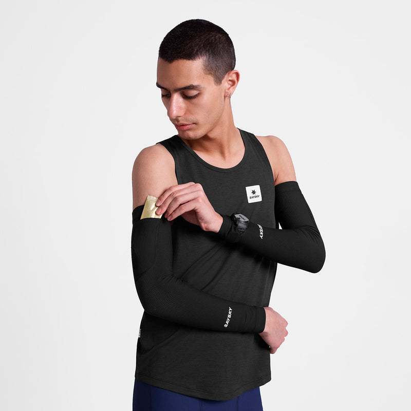 Combat Rib Sleeves on athlete’s arms featuring breathable fabric, gel pockets, and watch opening for race day performance