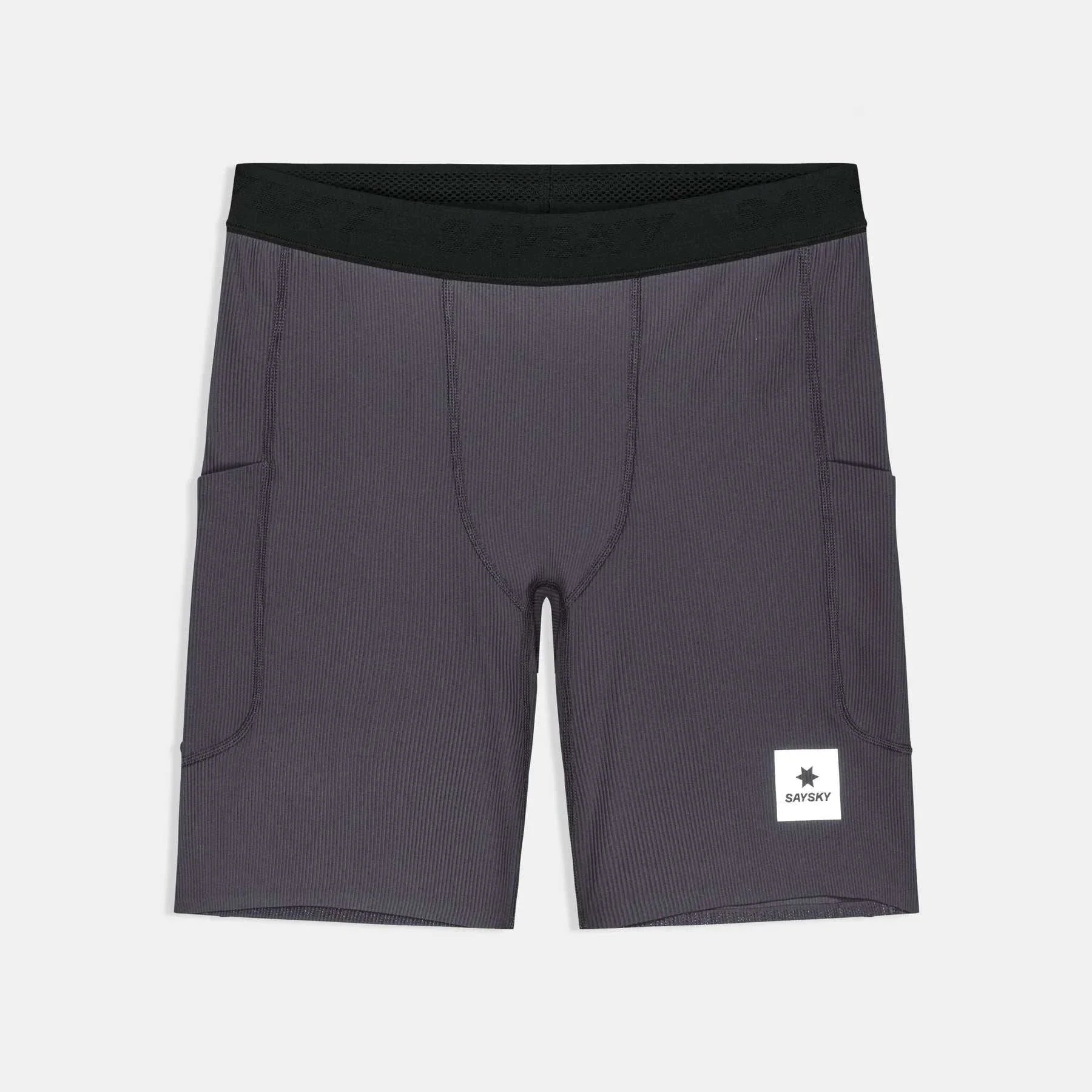 Combat+ Rib Short Tights in dark grey ribbed fabric with a black jacquard waistband, side pockets, and a white logo patch.