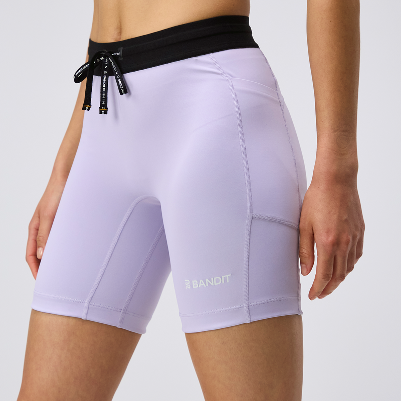 Stamina™ 7" Women's Compression Shorts in Light Thistle, side pockets, black waistband.