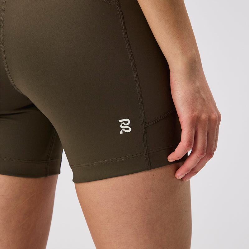 Stamina™ 5" Women's Compression Shorts - Dark Fatigue, featuring double-layer matte fabric and reflective details, shown with side pocket.