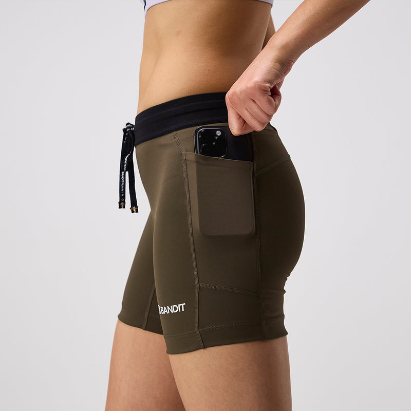 Stamina™ 5" Women's Compression Shorts in Dark Fatigue with side pocket and branded waistband.