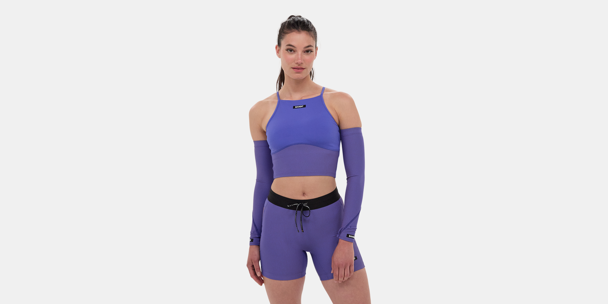 Stamina™ 7 Pocket Nova Crop in deep peri blue, featuring scoop neck, removable cups, and multiple pockets in performance fabric.