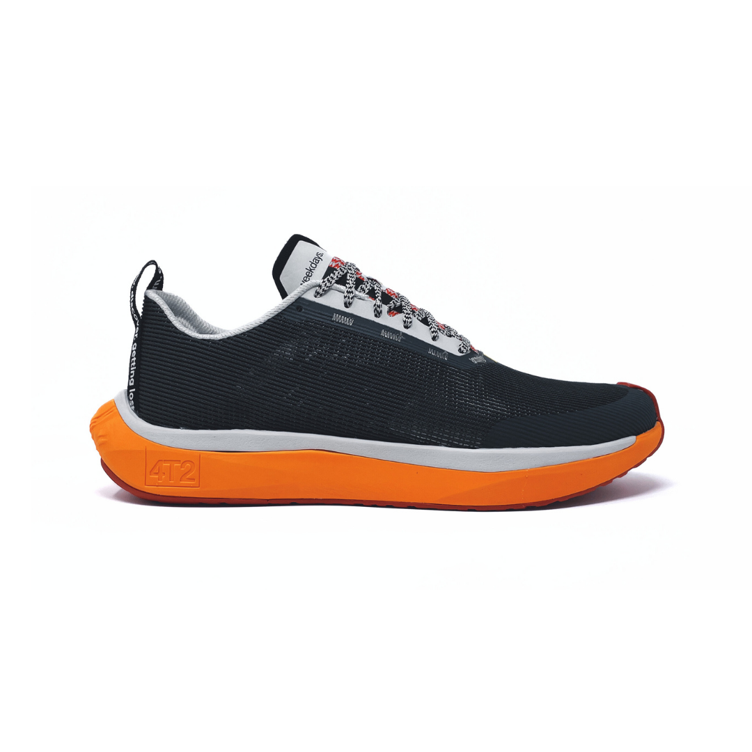 gender-neutral weekdays running shoe with black upper and orange sole