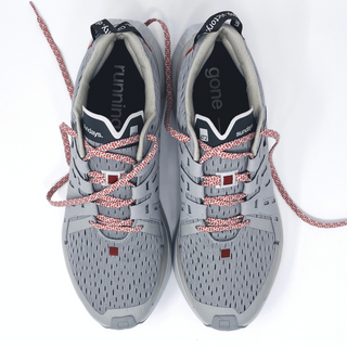 Gender-neutral grey running shoes designed for comfort and long-distance runs on Sundays.