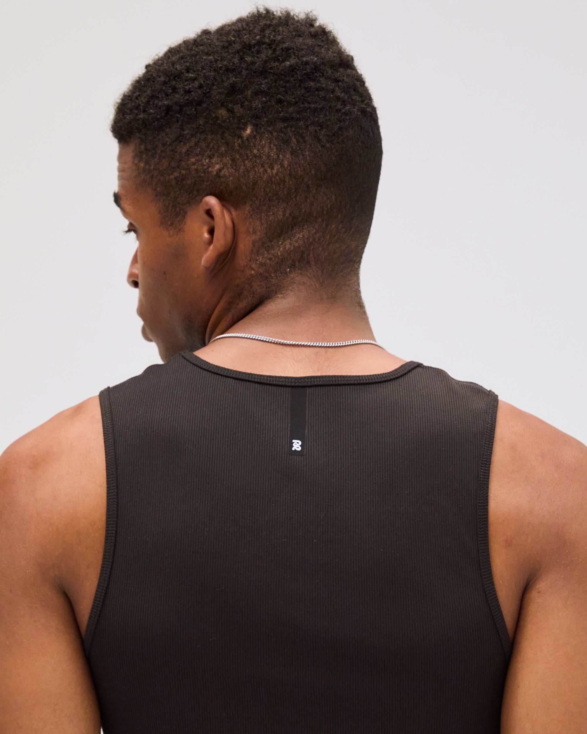 Back view of Men's Tassarib™ Vituccio Performance Tank in black, featuring a sleek and breathable design.