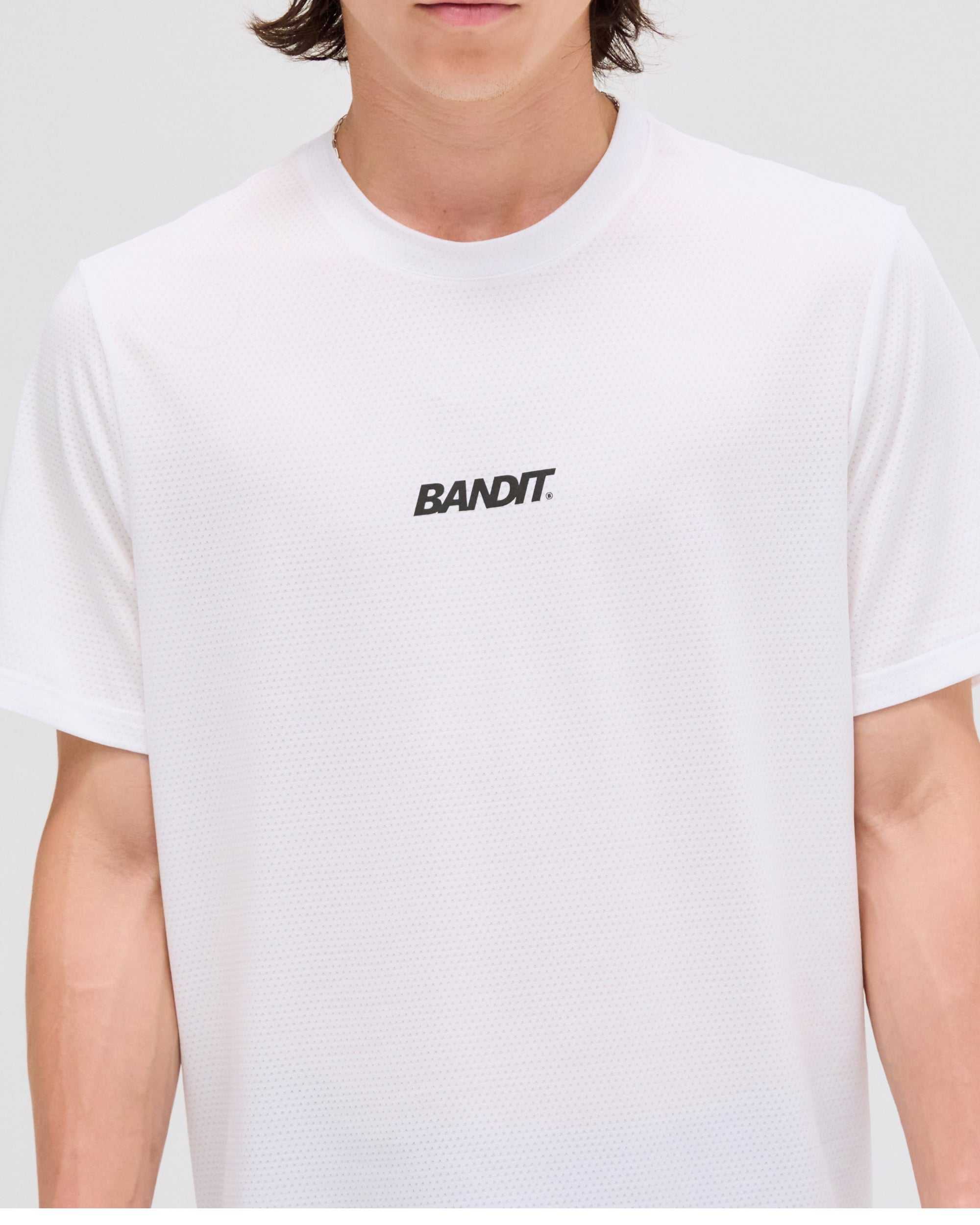Men's white micromesh run tee with Bandit logo on front.