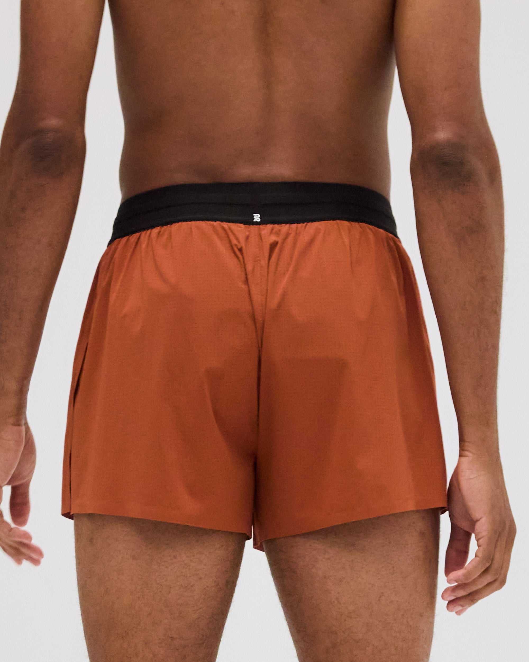 Men's Vento™ 3" Split Short in rust, showcasing back view and black waistband.