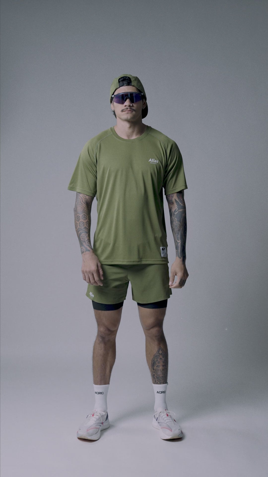 Olive green performance running t-shirt for men with moisture-wicking and quick-dry features, made from recycled materials.