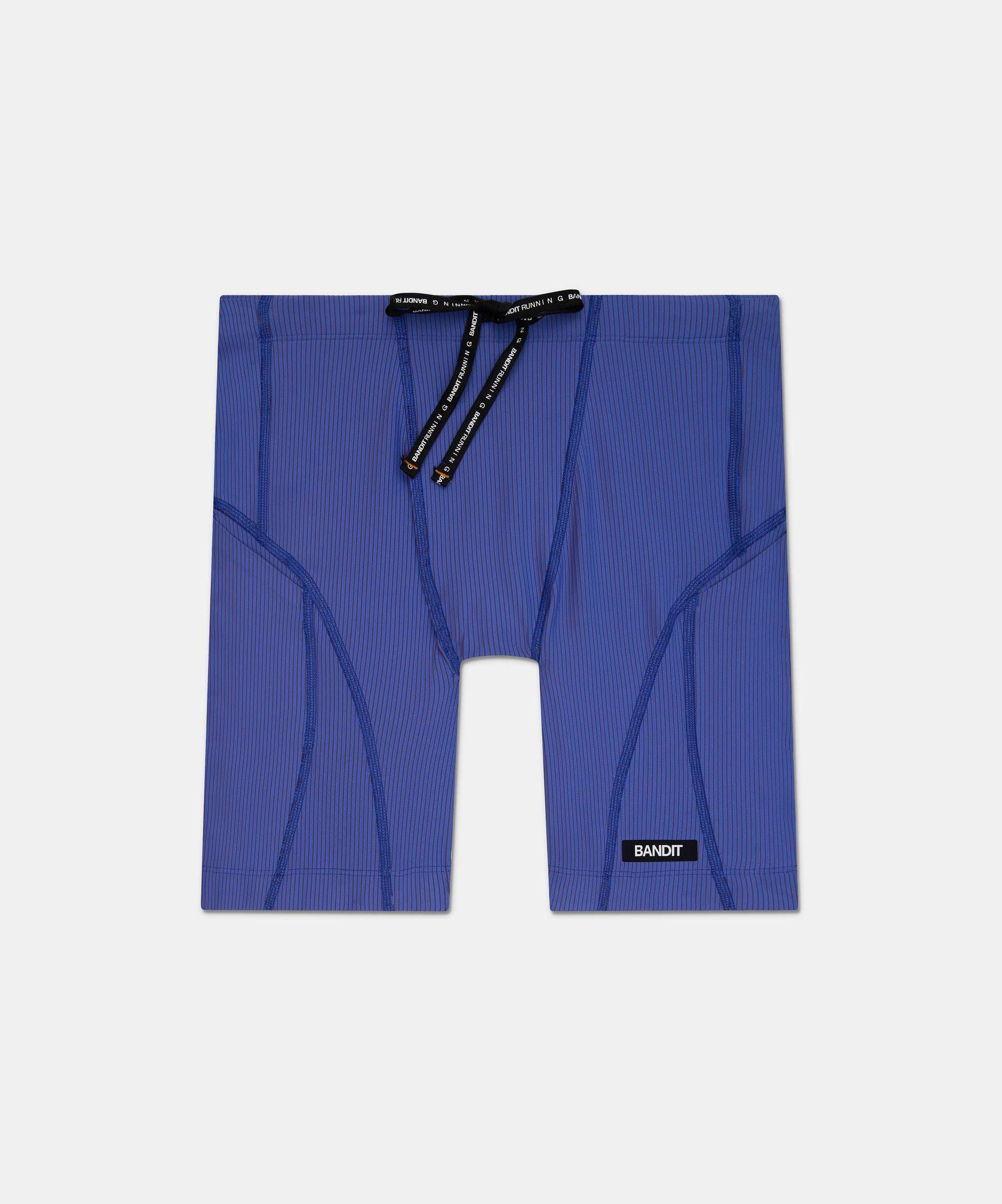 Striped Cadence™ 7 Pocket Quarter Tights in Deep Peri Blue with Rust.