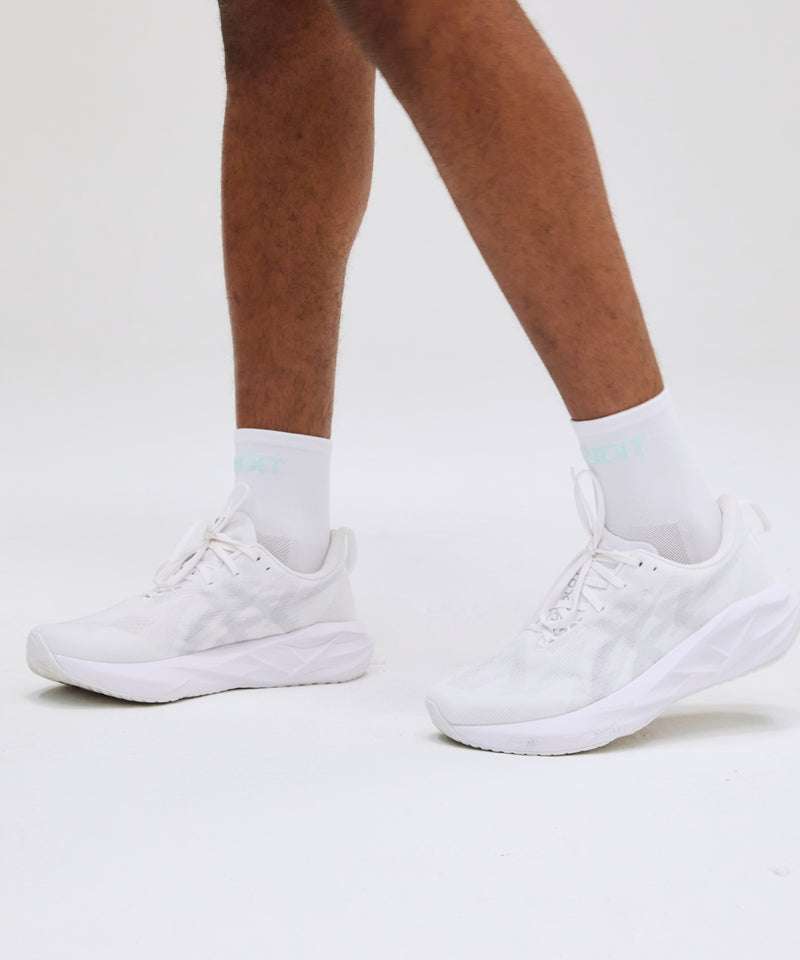 Lite Run™ Socks in white with minty blue, lightweight, sweat-wicking, and fast-drying.