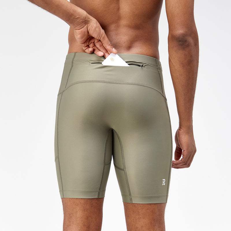 Superbeam™ Next Gen 7 Pocket Half Tights in Fatigue color, featuring reflective branding and back-zipper pocket.