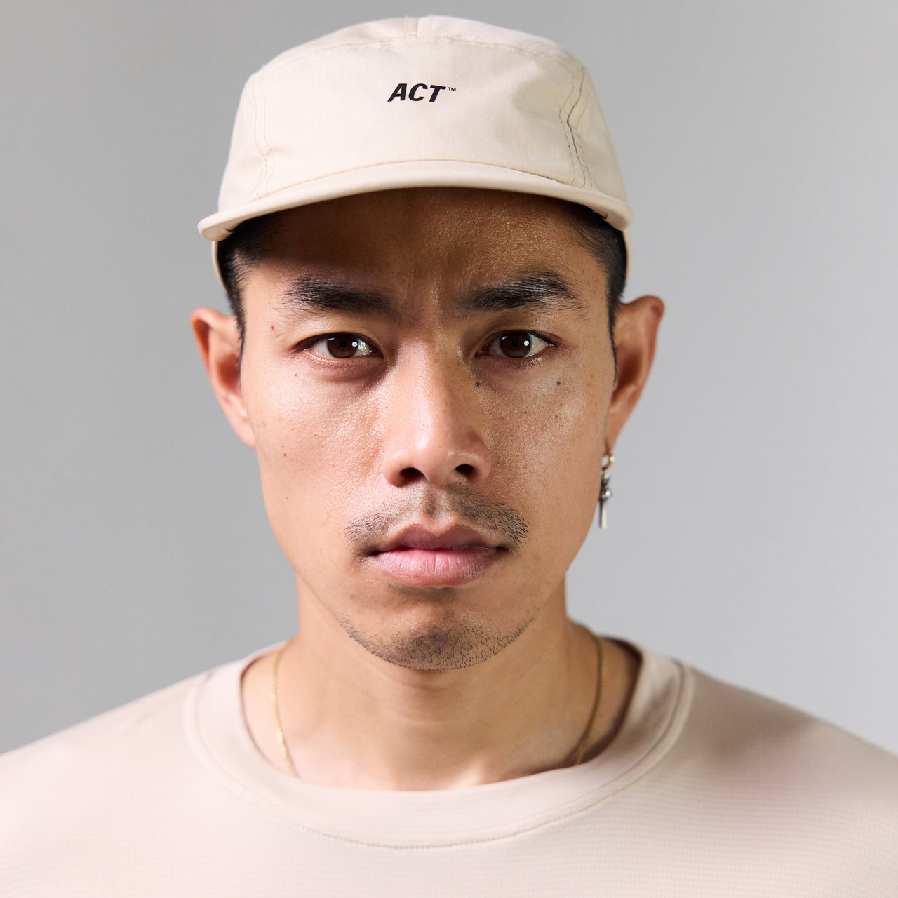 Beige running cap made from eco-friendly, lightweight ripstop nylon.