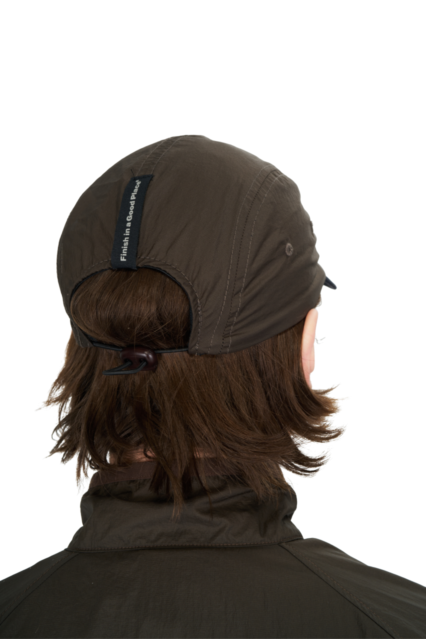 GRS Recycled Polyester UNNA Running Cap in Wren Brown with adjustable strap.