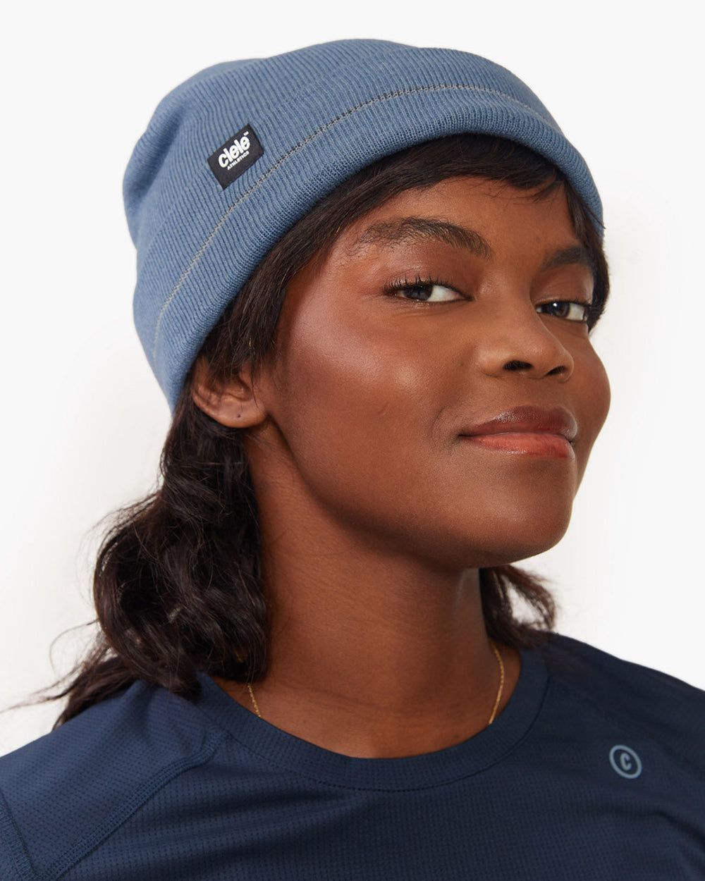 CR3Beanie - Nandoah in blue with reflective stripe, worn by a person.