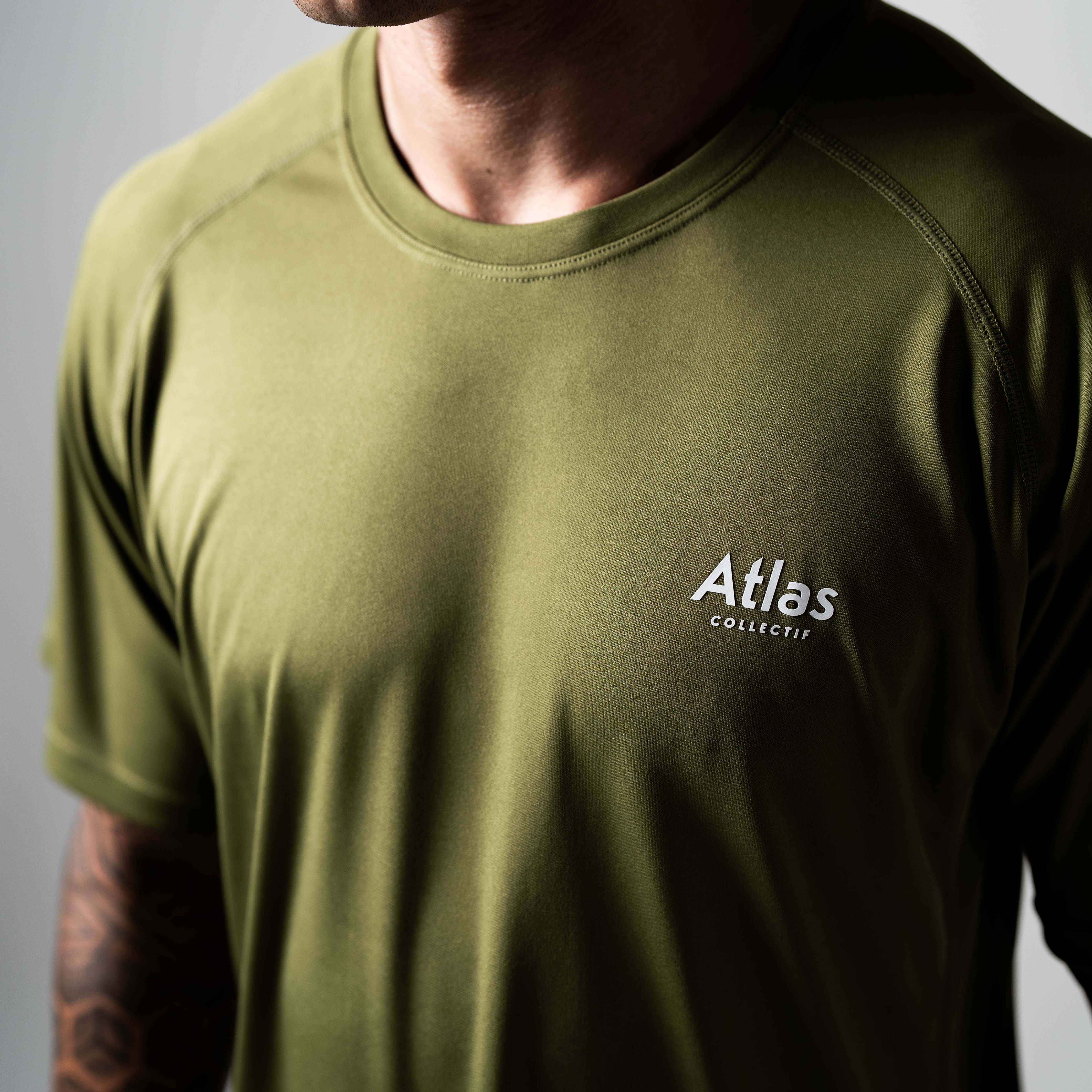 Olive green performance running T-shirt made from recycled materials with moisture-wicking and antibacterial properties.