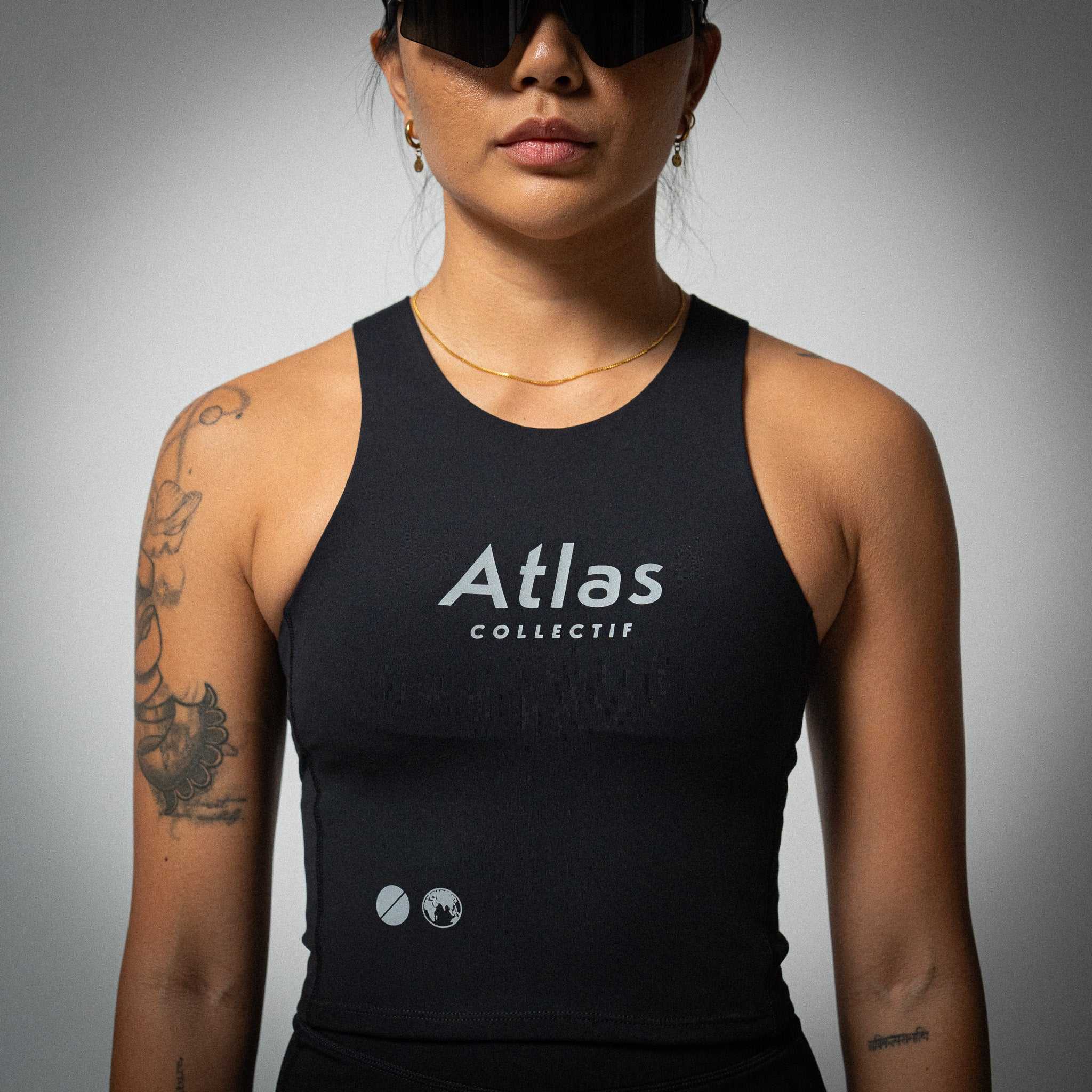 Illumi Trax WMNS Running Crop Tank Black, women's performance running top with reflective elements.