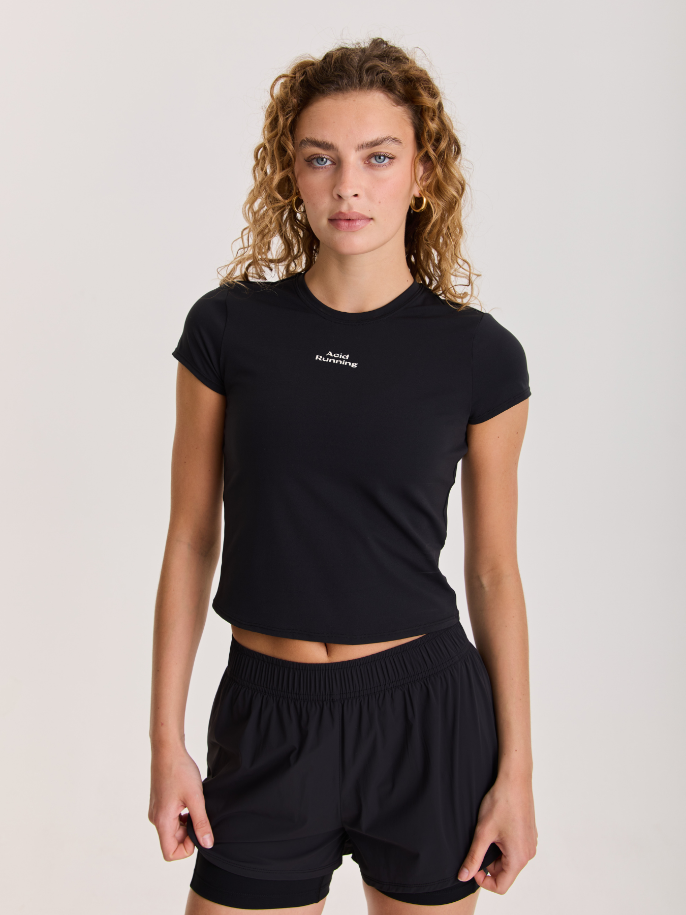 Women's Fitted T-Shirt in black with a crew neckline, short sleeves, fitted silhouette, and small white logo on the chest.