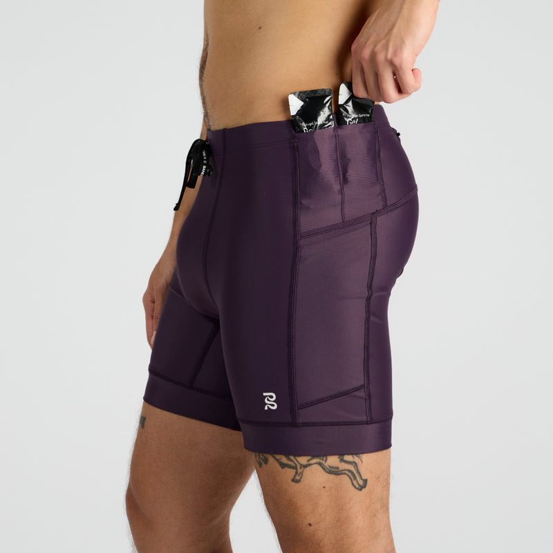 Superbeam™ Gen 7 Pocket Quarter Tights with multiple pockets and reflective branding.