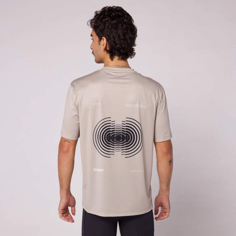 Sliced Spiral Drift™ Performance Tee - Stone with seasonal graphic design on back.