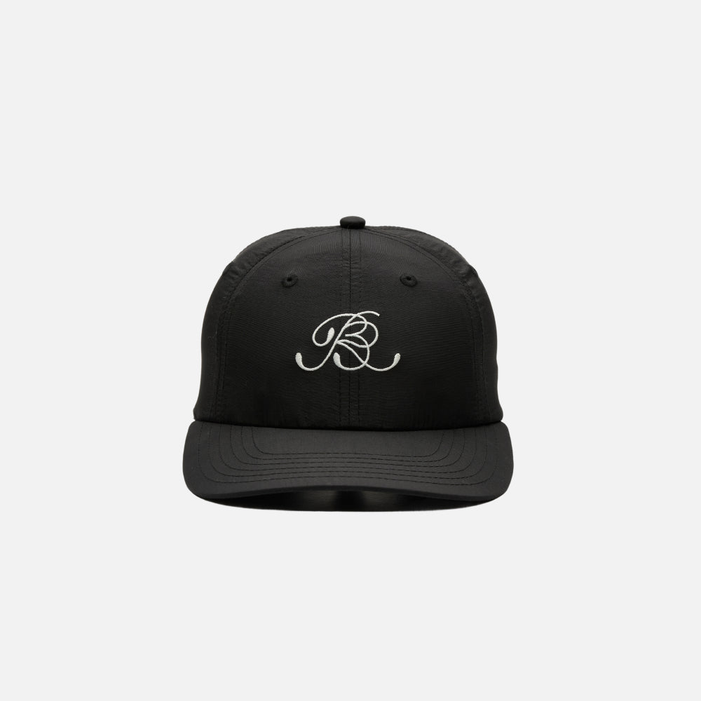 Cursive "BR" black nylon dad hat with embroidered branding and adjustable closure.