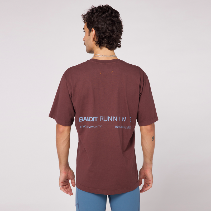 Community Tee Unisex - Chocolate with Smokey Blue print, featuring a relaxed fit and crew neckline, made from 100% combed cotton.