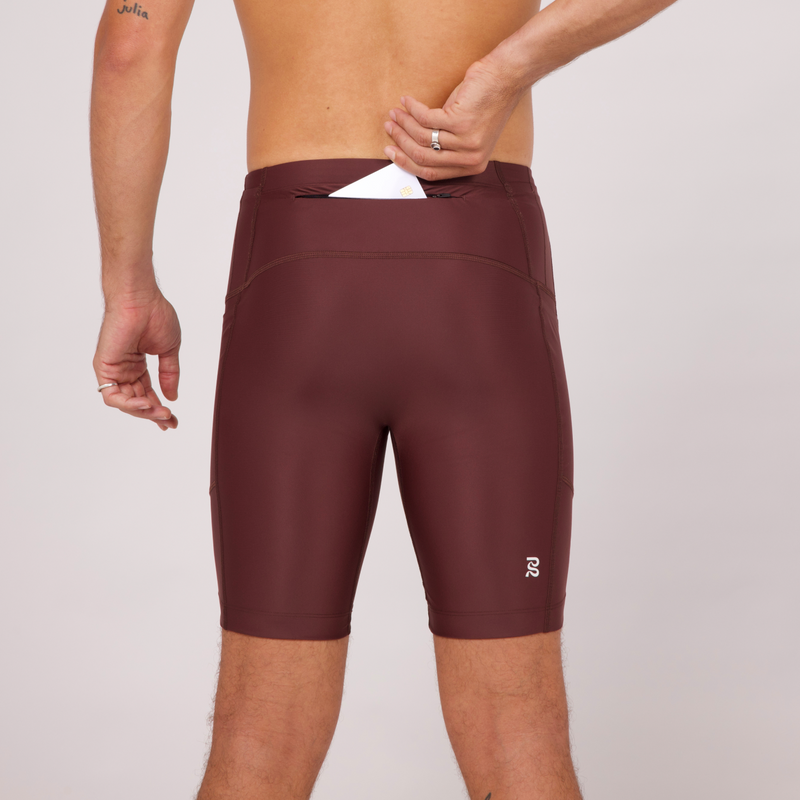 Superbeam Half Tights in Chocolate with 7 pockets, UV protective compression fabric, and reflective branding.