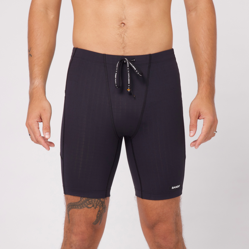 Gridlock™ Next Gen 7 Pocket Half Tights, breathable compression fit, black, 8" inseam, multiple pockets.