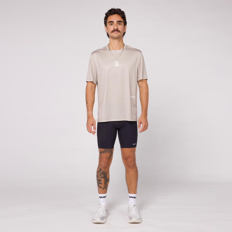 Gen 7 Pocket Half Tights in Gridlock fabric featuring 7 pockets, model wearing a light grey t-shirt, compression fit.