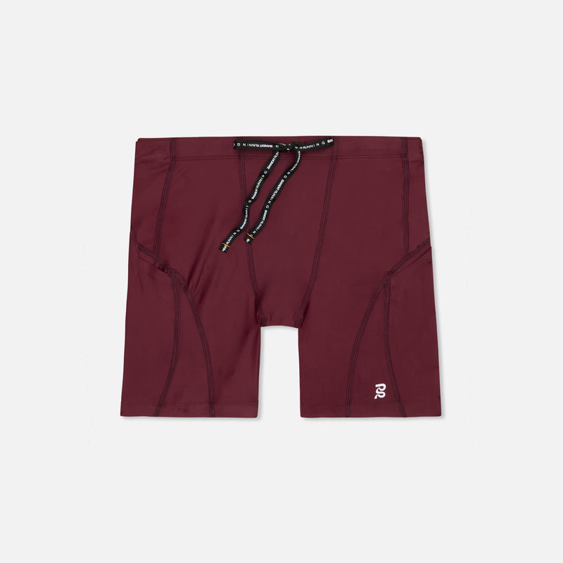Superbeam™ Next Gen 7 Pocket Quarter Tights in Port color with drawstring and reflective branding.