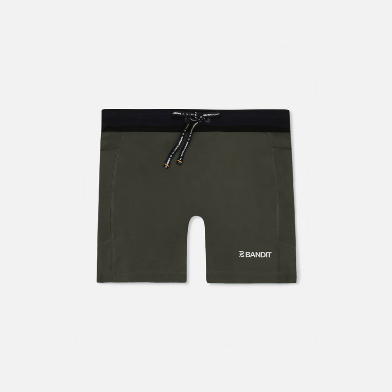 Stamina™ 5" Women's Compression Shorts in Dark Fatigue with anti-bounce pockets and reflective graphics.