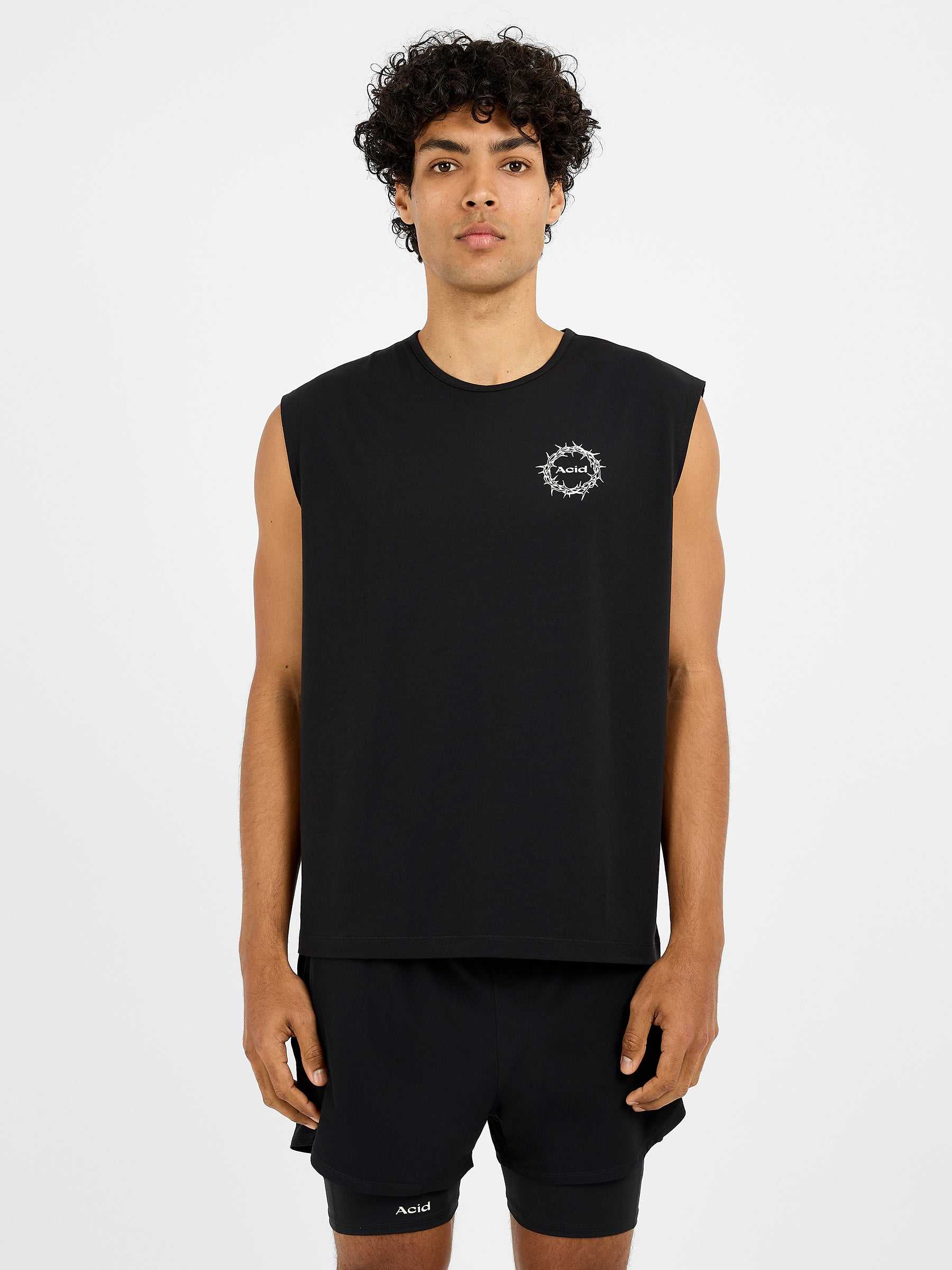 Men's The Good Fight Tank in black with sleeveless design, crew neck, and small white circular logo on chest.
