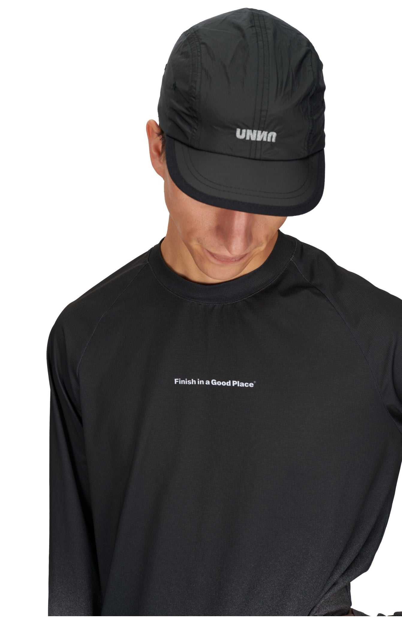 Men's black & grey running long sleeve t-shirt by UNNA with gradient design and moisture-wicking fabric.