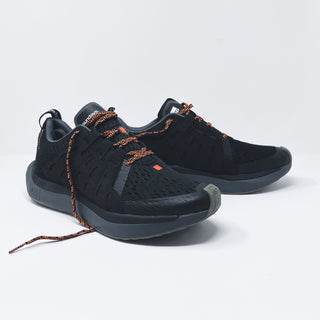 Shades of black sneakers with breathable mesh, smooth sole, and orange accents for comfortable Sunday wear.