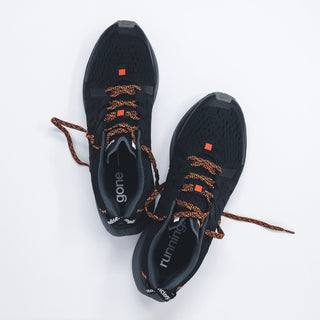 Sundays running shoes in shades of black, featuring breathable upper and smooth outsole for comfortable long-distance runs.