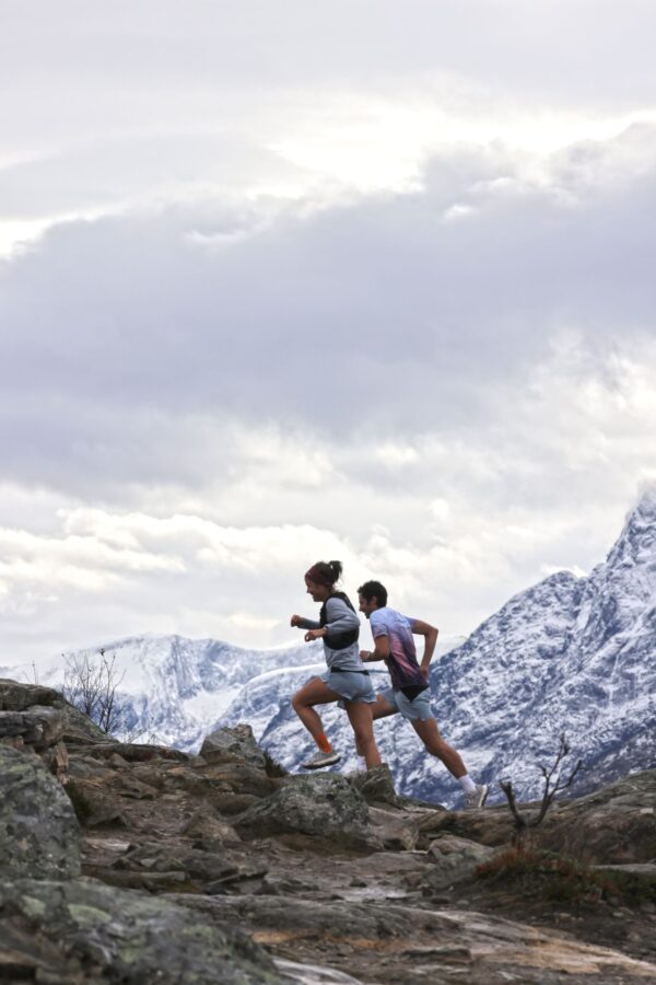 COROS APEX 2 - GREY GPS outdoor watch on hikers in snowy mountains.