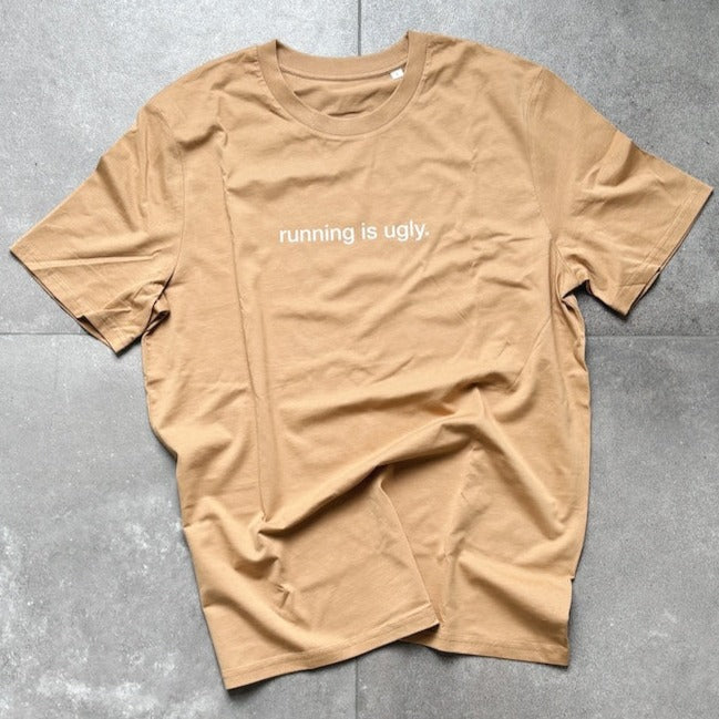 Organic cotton tee with "running is ugly" text, relaxed unisex fit.