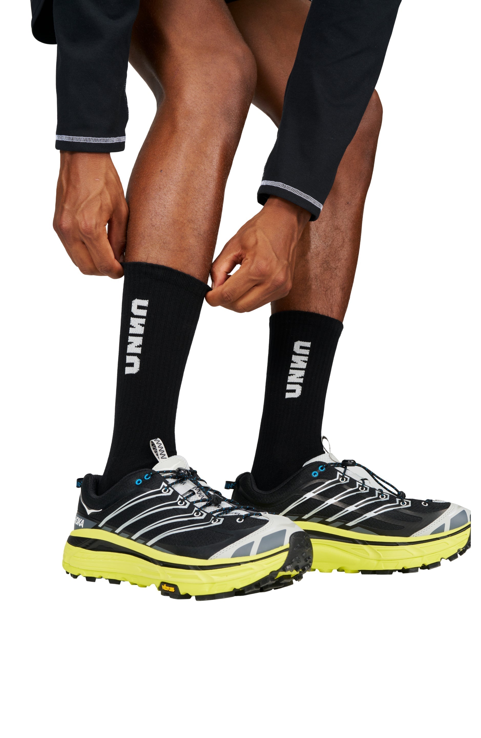 Recycled running socks in black with UNNA logo.