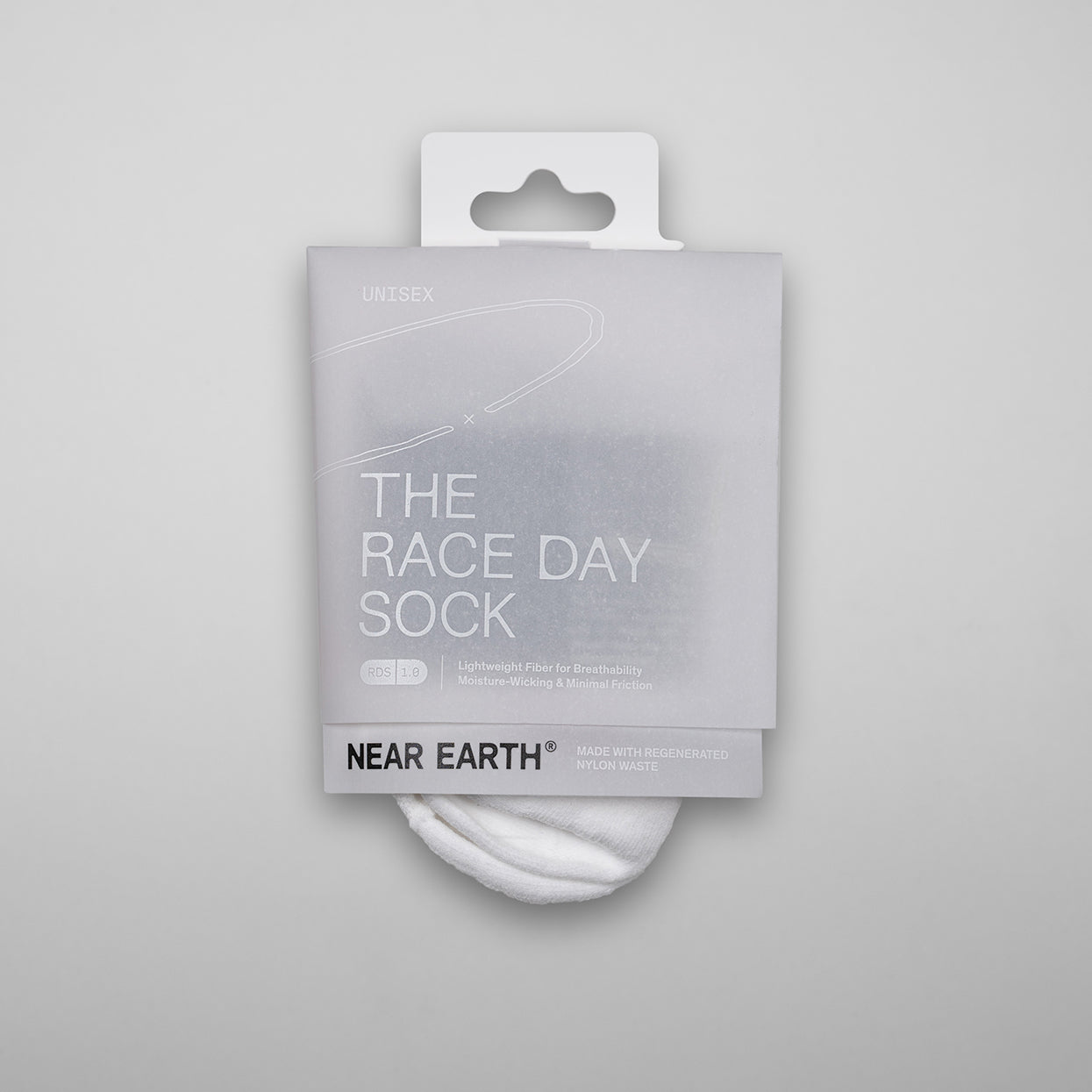 Near Earth Race Day Sock in white packaging, ultralight and form-fitting design.