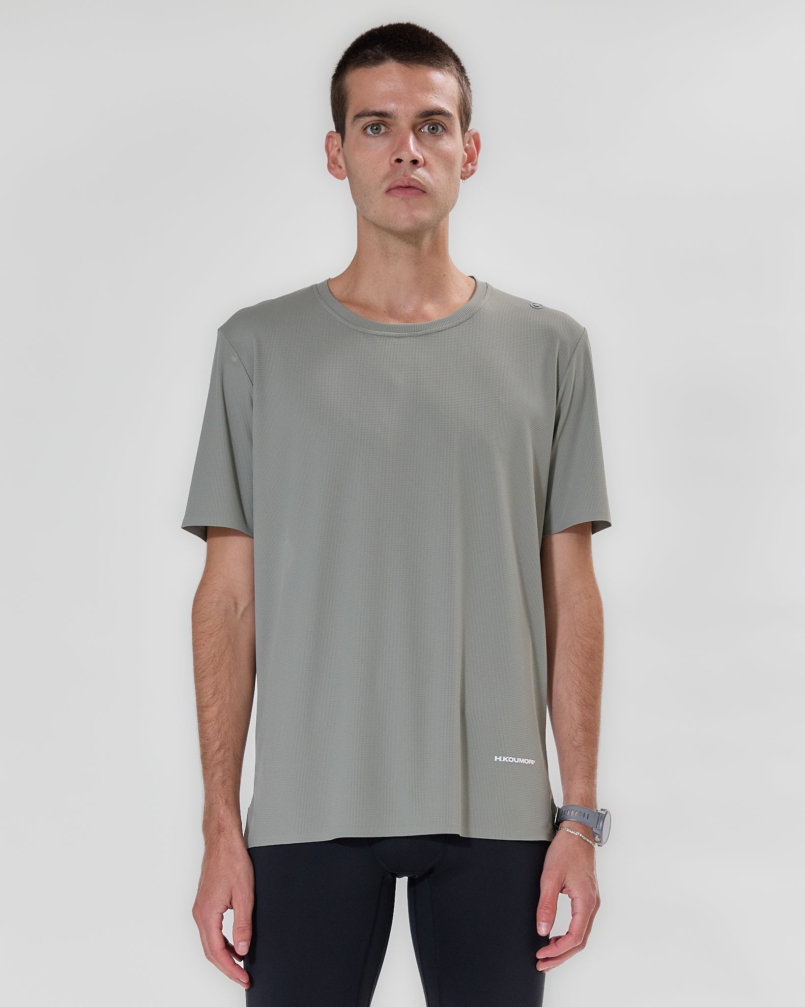 H.Koumori Training T-Shirt in moss green on model, lightweight and breathable design.